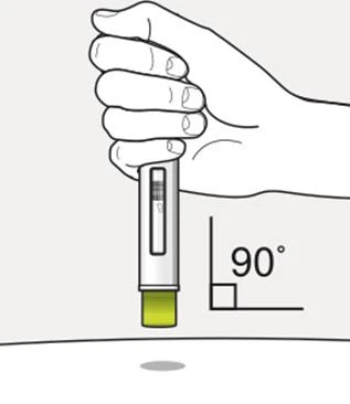 Una mano tiene una penna iniettiva in posizione verticale a 90 gradi rispetto alla superficie della pelle per l'iniezione