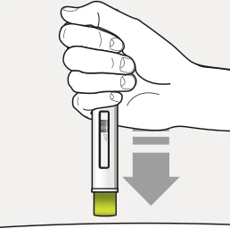Una mano tiene verticalmente un dispositivo medico per l'iniezione verso il basso indicato da una freccia grigia sopra una superficie piana