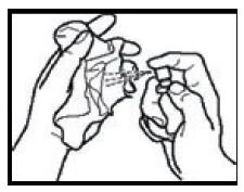 Two hands extracting the contents from a glass vial using a syringe with a needle to withdraw the liquid medication