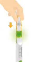 A hand holding a white medical device with a green section and an orange arrow pointing downward indicating movement