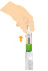 A hand holding a cylindrical white and green medical device with an orange arrow pointing toward the