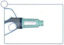 A hand holds horizontally a medical device in blue and gray with a central transparent window for monitoring
