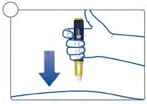 A hand holds vertically a yellow and black medical device with a blue arrow pointing downward indicating a pressing movement