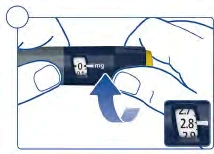 Two hands hold a medical device with a display showing 0 mg and a blue arrow indicating rotational movement to adjust the dosage