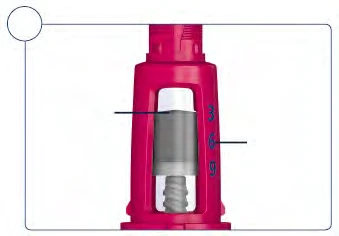 Pink medical device with a lateral numerical scale 3, 6, 9 and internal gray and white components visible through a transparent section