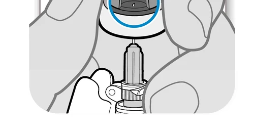 Two hands holding a medical device with a thin needle protruding downward from the bottom in a