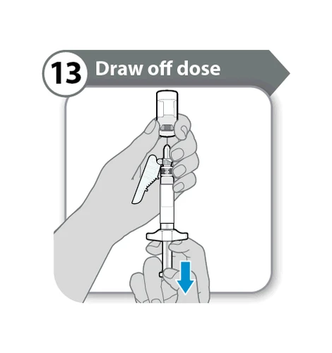 Two hands holding a vial and a syringe to aspirate medication with a blue arrow pointing downward on the syringe