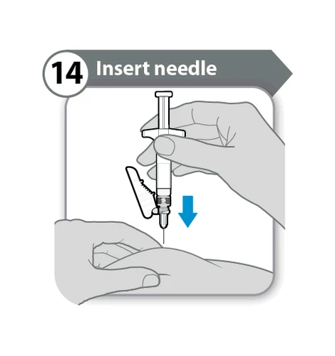 One hand holding a syringe vertically while the