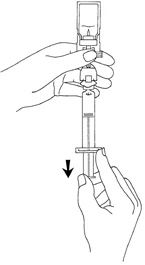 One hand holding a vial with needle while the