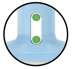 Close-up of a blue medical device with two small green circles arranged vertically