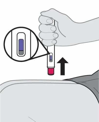 Una mano impugna un dispositivo medico cilindrico con un ingrandimento che mostra una finestra con liquido blu e una freccia nera rivolta verso l'alto