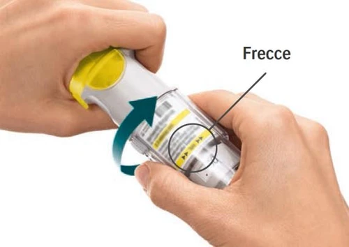 Two hands holding a cylindrical medical device with a blue curved arrow indicating rotation to the left
