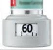 Close-up of a medical device with a digital display showing the number 60 on a white background, with small black indicators