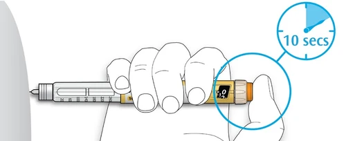 A hand holding a horizontal injection pen with a circular timer indicating a