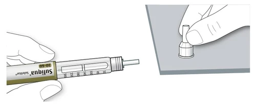 A hand holding a Suliqua SoloStar injection pen and the