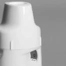 Dettaglio ravvicinato di un dispositivo medico bianco cilindrico con una piccola finestra rettangolare scura sulla parte inferiore