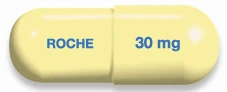 Yellow capsule with the word ROCHE in blue on one side and the label 30 mg on the other