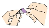 Two hands holding and rotating a small cylindrical medical device with a purple cap to open or prepare it for
