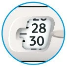 Detail of a medical device with a circular display showing numbers 28 and 30 in black on a white background with a blue border