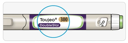 Close-up of a Toujeo 300 DoubleStar injection pen with numerical indicator showing the value 0 out of 24 highlighted by a blue circle