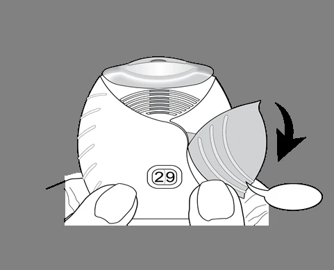 Illustration of a white medical device with number 29, showing a hand rotating a side part downward following a black arrow