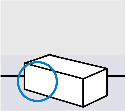 Diagrama esquemático de un objeto rectangular blanco con un círculo azul que resalta el