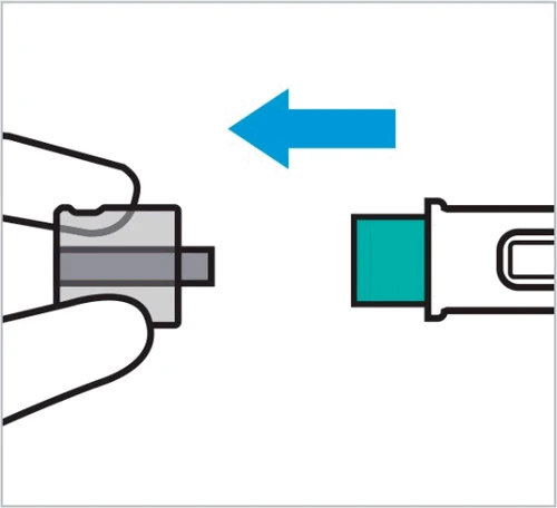 Una flecha azul indica el movimiento de inserción de un componente verde en un dispositivo médico blanco sostenido entre los dedos