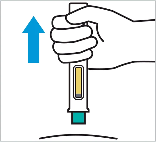 Una mano sostiene verticalmente un dispositivo médico con una flecha azul dirigida hacia el