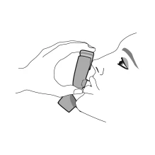 Disegno lineare di una persona che tiene un dispositivo medico a forma di cilindro vicino alla bocca per l'inalazione del farmaco