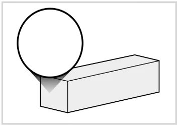 Schematic black and white diagram showing a black circle positioned above a three-dimensional gray rectangle on a white background