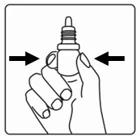 A hand grasping a medical vial between the thumb and the