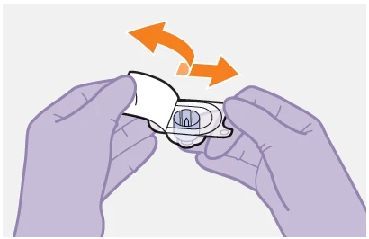 Two gloved hands holding a white transparent medical device with a curved orange arrow indicating a rotational movement