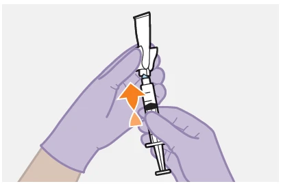 Gloved hands drawing liquid from a vial using a syringe, following the direction of an orange arrow pointing upward