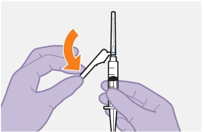 Gloved hands rotating a white cap downward on a syringe containing dark liquid and a vertical needle indicated by an orange arrow