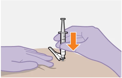 Gloved hand pressing a syringe vertically with an orange arrow toward the patient's skin for
