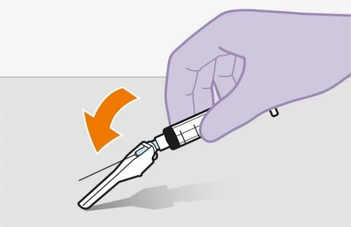 A purple gloved hand tilting a syringe downward with an orange arrow indicating a downward rotational movement
