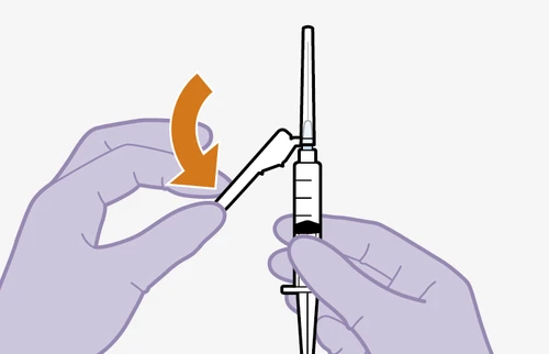 Two gloved hands manipulating a syringe with a curved orange arrow indicating rotational movement of a white cap on the tip