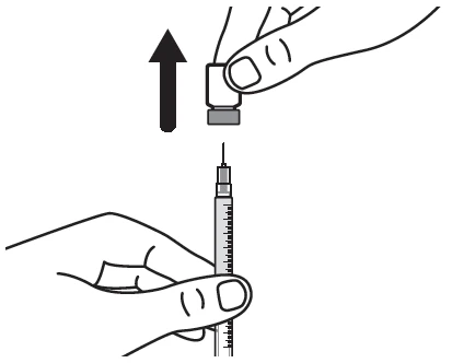 A hand vertically lifting the protective cap from a syringe needle, indicated by a black arrow pointing upward