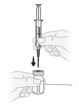 One hand holds a syringe with needle pointing toward the stopper of a glass vial for the