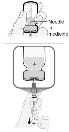 Technical drawing showing a hand inserting the