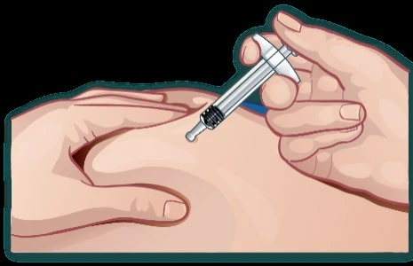A hand holding a syringe with a needle pointing for the