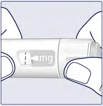 Dos manos sostienen un dispositivo médico blanco con una ventana transparente que muestra la inscripción mg y una línea de dosificación negra