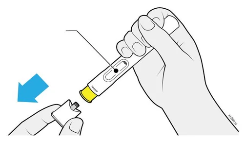 A hand holds a white and yellow medical device while another element is implied