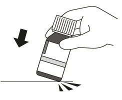 A hand holding a tilted vial over a flat surface with a black arrow pointing downward toward the container's base