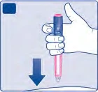 Una mano sostiene verticalmente un dispositivo médico cilíndrico rosa y azul con una flecha azul dirigida hacia abajo hacia una superficie curva