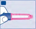 Una mano sostiene un dispositivo médico cilíndrico horizontal con cuerpo rosa transparente y empuñadura azul sobre fondo claro