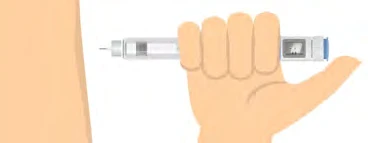 A hand holds a transparent injection pen horizontally with an exposed needle near the skin of a light-colored arm