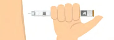 A hand holds horizontally a white and transparent medical injection pen ready for the