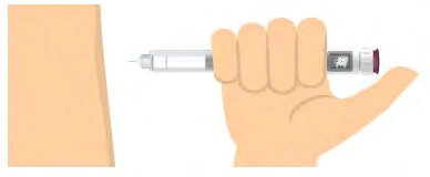 A hand holds an injection pen horizontally to bring it closer to the