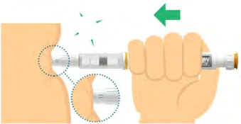 A hand holds an injection pen to apply it against the skin of the
